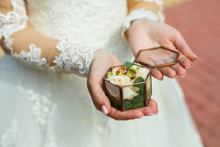 Golden wedding rings for newlyweds on their wedding day