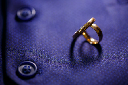 Gold wedding rings for newlyweds on wedding dayの写真素材
