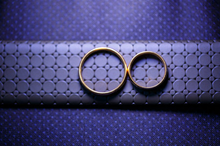 Gold wedding rings for newlyweds on wedding dayの写真素材