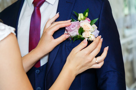 Bride cuddle with groom on wedding dayの写真素材