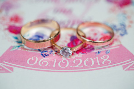 Golden wedding rings for newlyweds on their wedding dayの写真素材
