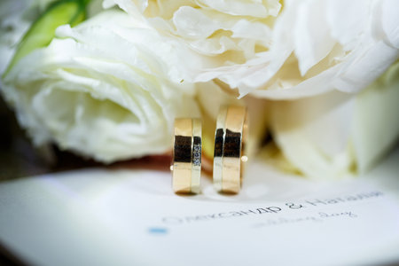 Gold wedding rings for newlyweds on wedding dayの写真素材