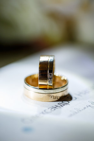 Gold wedding rings for newlyweds on wedding dayの写真素材