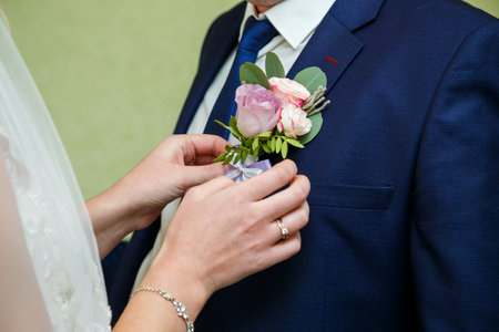 Bride cuddle with groom on wedding dayの写真素材