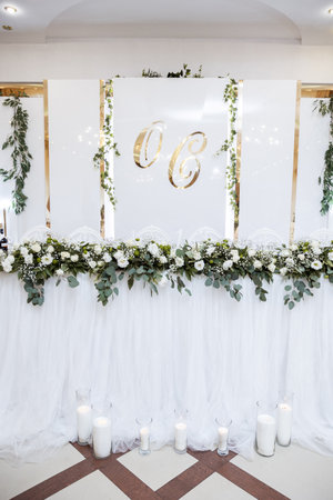 Beautiful wedding arch of flowers for the newlyweds. Decoration on a holidayの写真素材