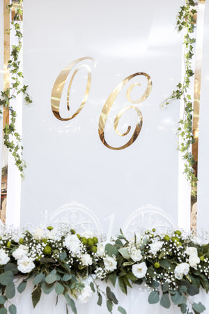 Beautiful wedding arch of flowers for the newlyweds. Decoration on a holidayの写真素材