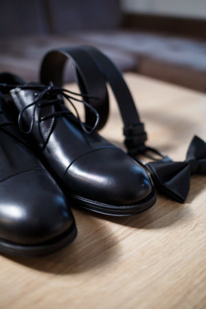 Morning details of a stylish groom with leather shoes