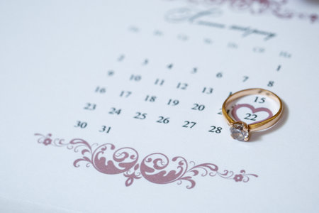 Gold wedding rings for newlyweds on wedding dayの写真素材