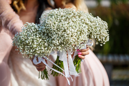 Bouquets of bridesmaids holding bouquets in the centerの写真素材