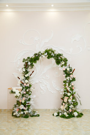 Wedding decor made of flowers and fabric. Beautiful decorations for newlyweds on their wedding dayの写真素材