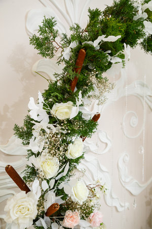 Wedding decor made of flowers and fabric. Beautiful decorations for newlyweds on their wedding dayの写真素材