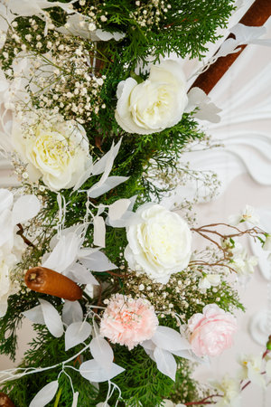 Wedding decor made of flowers and fabric. Beautiful decorations for newlyweds on their wedding dayの写真素材