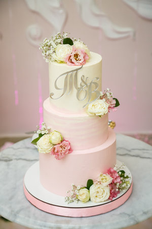 Beautiful tiered delicious dessert sweet cake for newlyweds.の写真素材