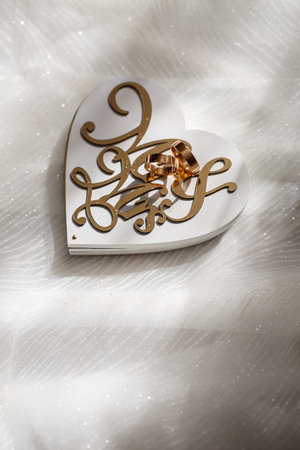 gold wedding rings on the wedding day for the newlyweds. Jewelry from expensive metalの写真素材
