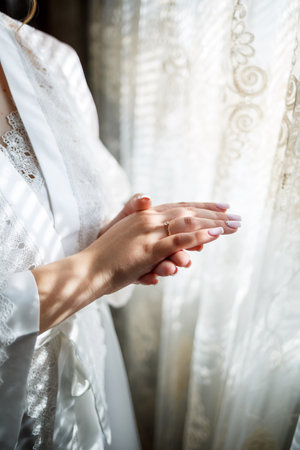 Beautiful young girl bride on a wedding day. White wedding dress. Modern dressy clothes for womenの写真素材
