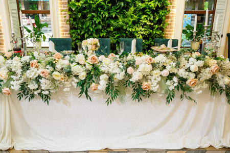 Wedding table decor for newlyweds decorations with fresh flowersの写真素材