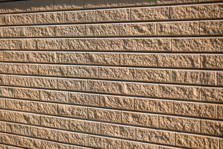 Brown brick. Brick texture, building material, smooth brick laying during repairの写真素材