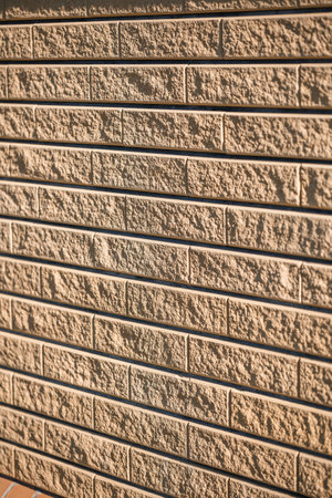 Brown brick. Brick texture, building material, smooth brick laying during repairの写真素材