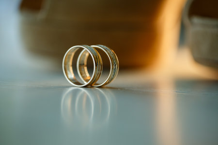 Gold wedding rings for newlyweds on wedding dayの写真素材
