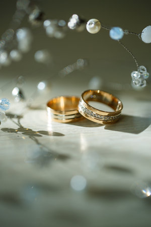 Gold wedding rings for newlyweds on wedding dayの写真素材