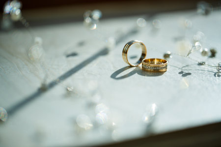 Gold wedding rings for newlyweds on wedding dayの写真素材