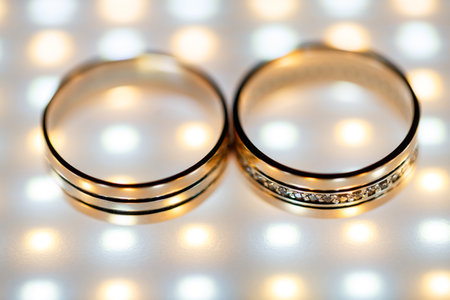Gold wedding rings for newlyweds on wedding dayの写真素材