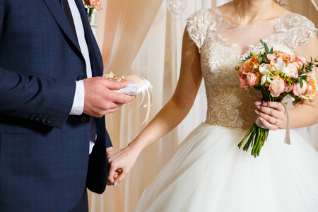 Golden wedding rings for newlyweds on their wedding dayの写真素材