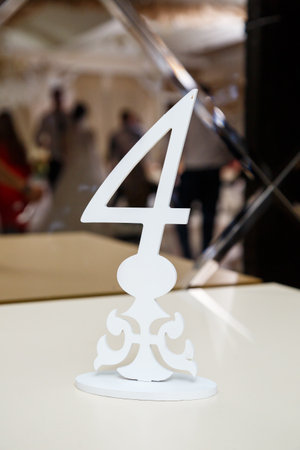 Numbers carved from wood on a standの写真素材