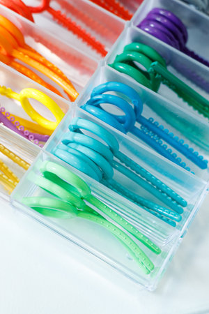 Colored elastic orthodontic bands for braces. Dentistry. Orthodontic treatment of teeth.
