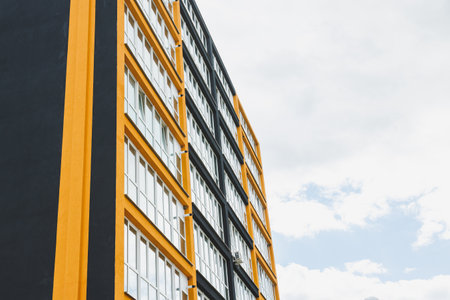 New modern multi-storey residential building. Plastic windows in a new apartment. Apartment with a...