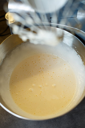 Beating cream for a sweet dessert in a food processor. Cream nozzleの写真素材