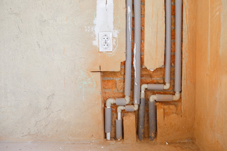 Installation of new plastic pipes in gates on the wall, repair work on the water supply. Plumbing...