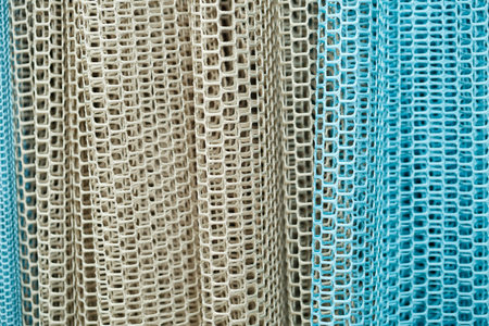 Curtains for windows, tulle with mesh texture in the apartment