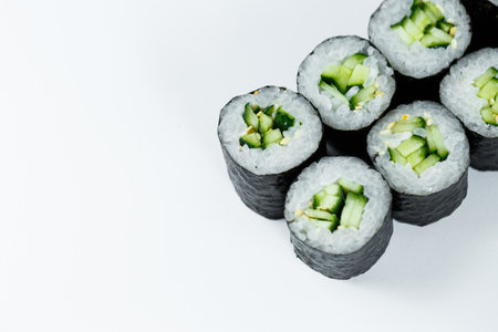 Japanese food. Rolls with ripe cucumber, fresh rice with vegetables in nori. Vegetarian rollsの写真素材