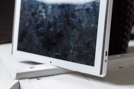 Tablet repair, replacement of glass on the tablet. Broken glass on a mobile deviceの写真素材