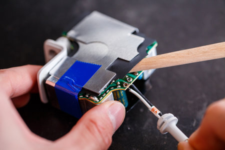 Repair white USB charger for gadgets and mobile phones. Charging from the mains for phone and laptop