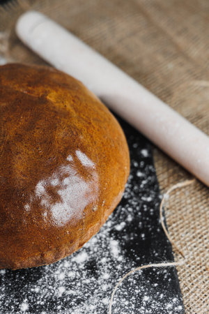 Top view of homemade bread with flour, natural agricultural products. Healthy and tasty pastries....