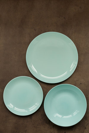 blue plates of different sizes and shapes on a gray background