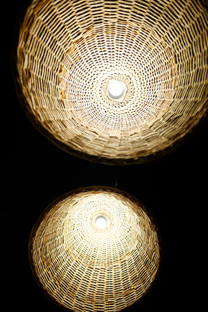 large wooden chandeliers with bulbs in the interior