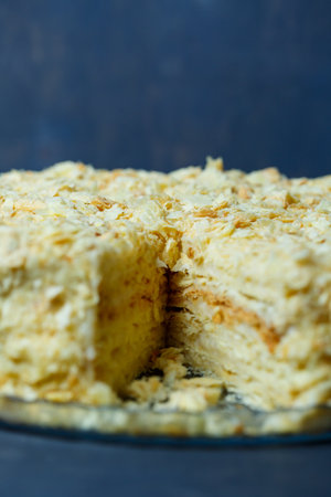 homemade Napoleon cake with cream on a gray backgroundの写真素材