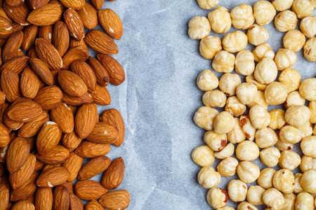 Roasted delicious nuts almonds and hazelnuts on a white background.の写真素材
