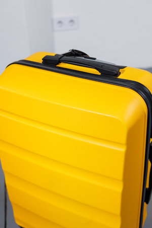 Yellow bright suitcase for tourist trips. High-quality yellow suitcaseの写真素材