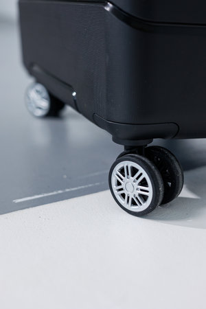 Black beautiful suitcase for tourist trips. High-quality black suitcaseの写真素材