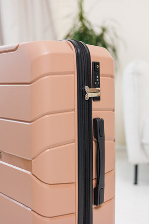 A beautiful pink suitcase for tourist trips. High-quality pink suitcase for things.の写真素材