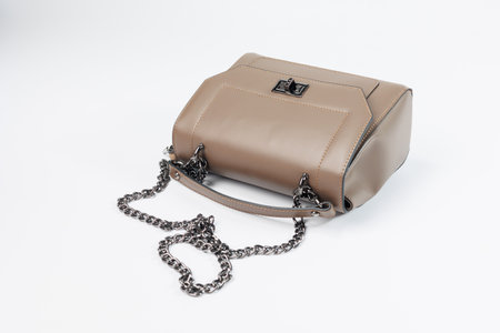 Beige leather women's handbag, Women's bag, beige women's bag. Women's bag isolated on white background. The bag is isolated on a white background.の写真素材