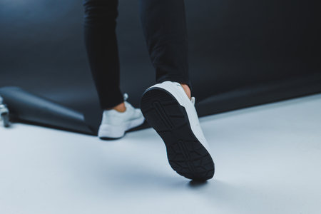 Men's casual white shoes made of genuine leather, men on shoes in white sneakers. High quality photoの写真素材