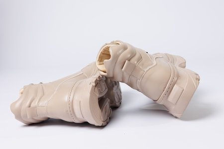 Beautiful shoes on an isolated white studio background. Fashionable beige women's shoe. Elegant stylish footwear.の写真素材