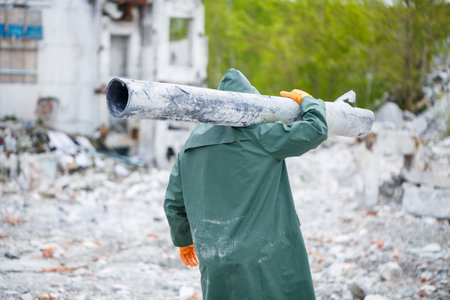 A man in a protective mask and protective clothing explores the danger zone. Ecological catastrophe....