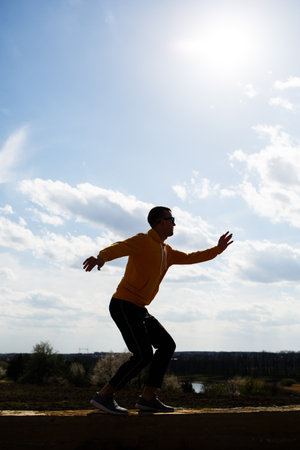 guy tourist freelancer on a background of blue sky with white clouds, bright sunny day, nature and...