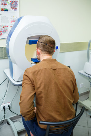Professional medical equipment scanning the patient's eyes. The device of a modern healthcare...